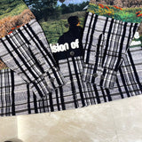 Flat lay presentation of Louis Vuitton luxury clothing with signature branding