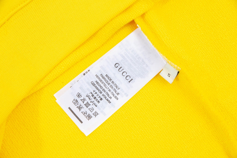 Close-up detail shot of Gucci luxury clothing with contemporary cut