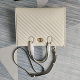 Front view of chic sleek women's handbag – women's statement bag