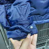 Side profile of Louis Vuitton luxury clothing with label-forward styling