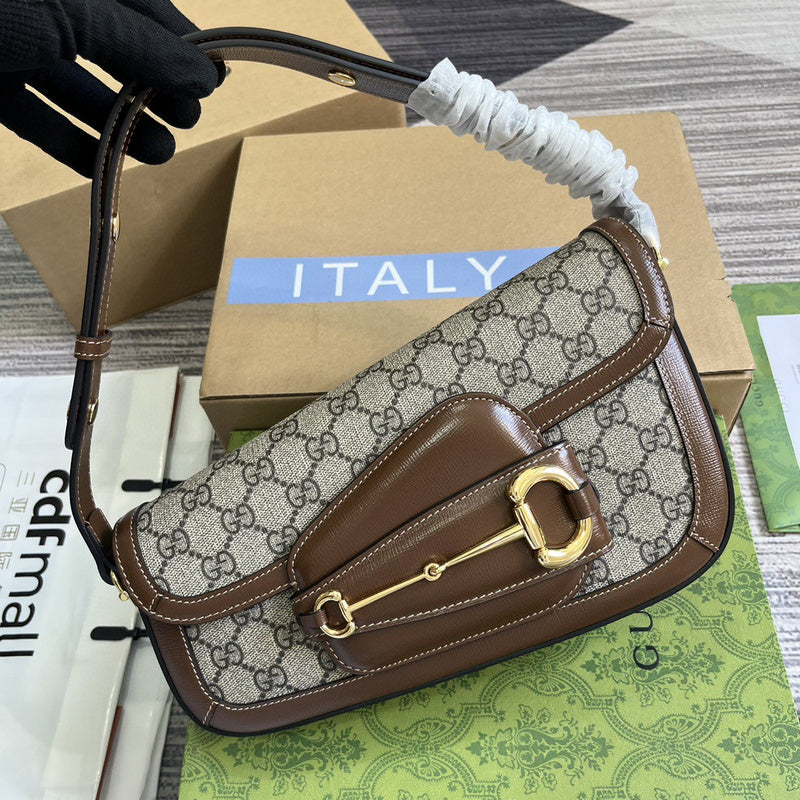 Front view of structured polished women's handbag – women's designer-style accessory