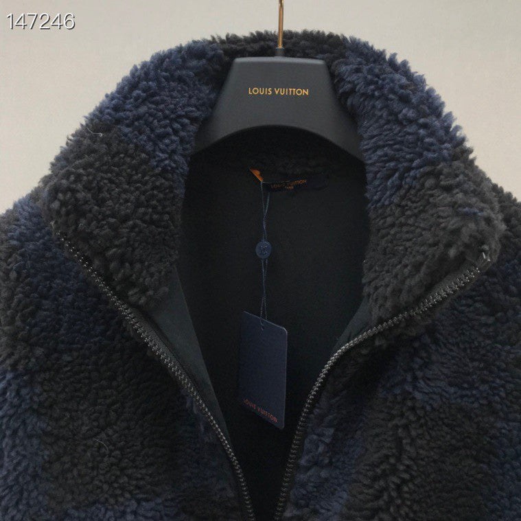 Close-up detail shot of Louis Vuitton luxury clothing with signature branding