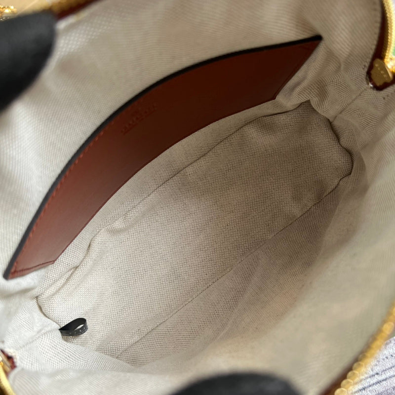 Side profile of modern elevated women's handbag – women's designer-style accessory