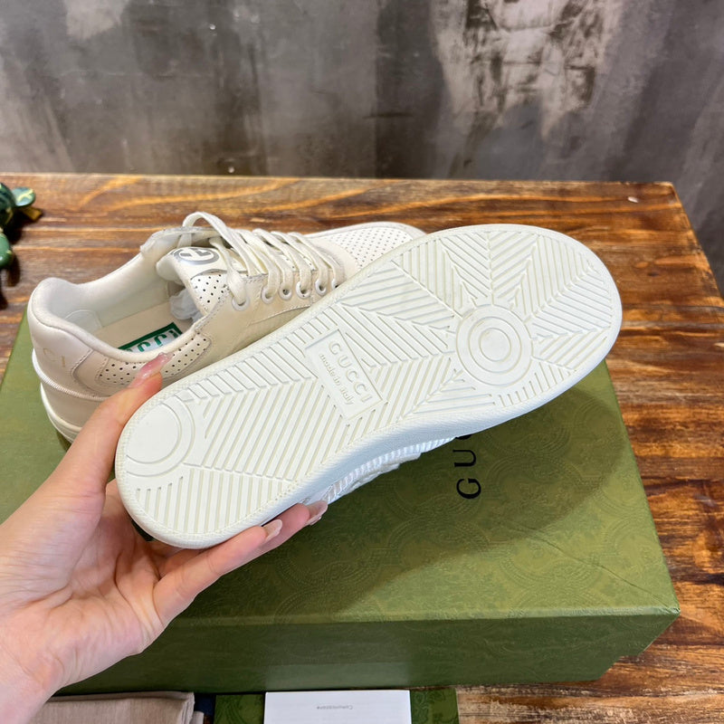Side profile of Gucci bold contrast sneakers signature lace-up style