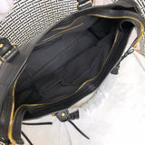 Side profile of refined statement women's handbag – women's luxury handbag