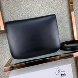 Styled lifestyle shot of elevated classic women's handbag – women's statement bag