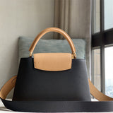  Sophisticated top-handle bag carried on shoulder