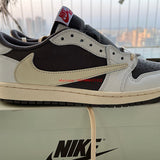 Side profile of Nike all-black sneakers low-top design