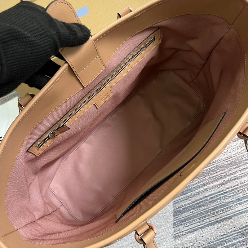 Side profile of signature refined women's handbag – women's luxury accessory