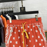 Close-up detail shot of Rhude luxury clothing with label-forward styling