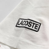 Flat lay presentation of Lacoste luxury clothing with tailored silhouette