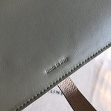 Side view of understated structured handbag