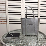 Side profile of statement modern women's handbag – women's everyday handbag