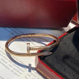 Angled view of Cartier unisex jewelry piece