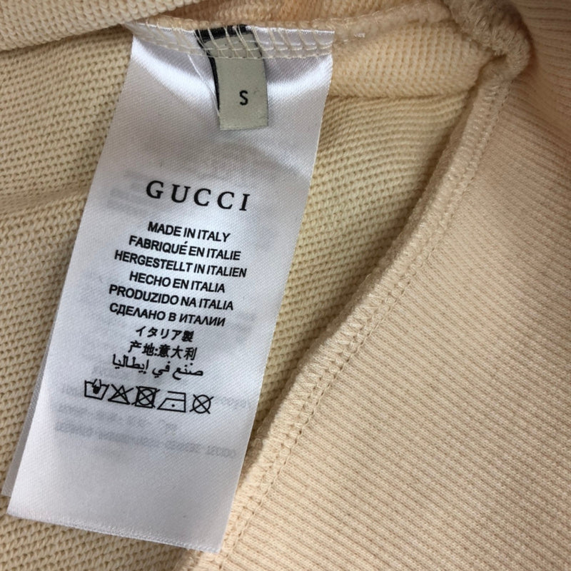 Side profile of Gucci luxury clothing with relaxed-fit cut