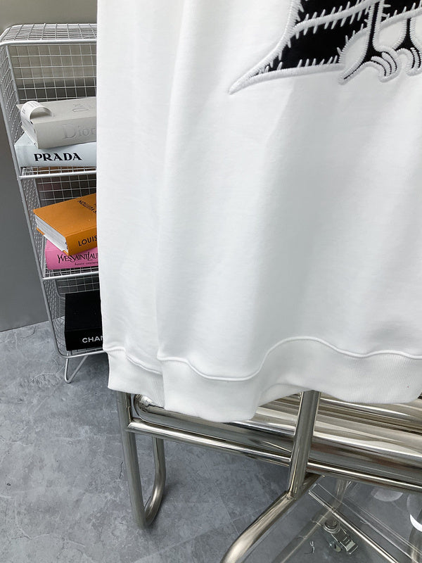 Flat lay presentation of Louis Vuitton luxury clothing with streetwear-inspired cut