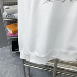 Flat lay presentation of Louis Vuitton luxury clothing with streetwear-inspired cut