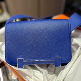 Side view of sculpted structured handbag