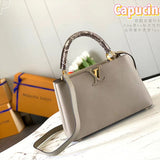 Side profile of sleek elevated women's handbag – women's luxury accessory