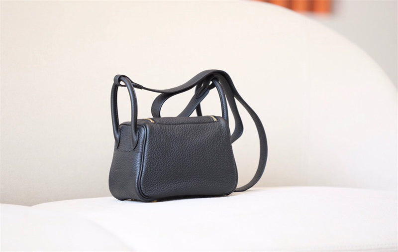 Refined carryall bag carried on shoulder