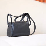  Refined carryall bag carried on shoulder