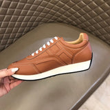 Hermès White High-Top Sneakers - Close-Up Texture View