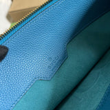 Handle and strap detail of sleek modern women's handbag – women's luxury accessory