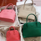 Side view of tailored structured handbag