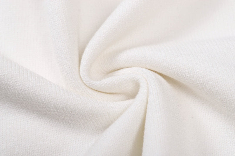 Close-up detail shot of Louis Vuitton luxury clothing with label-forward styling