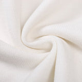 Close-up detail shot of Louis Vuitton luxury clothing with label-forward styling