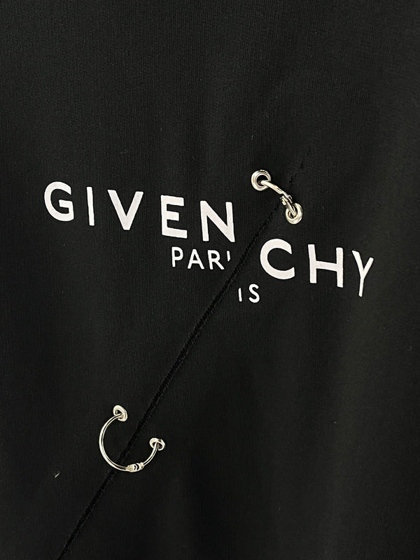 Flat lay presentation of Givenchy luxury clothing with contemporary cut