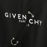 Flat lay presentation of Givenchy luxury clothing with contemporary cut