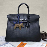 Side view of poised structured handbag