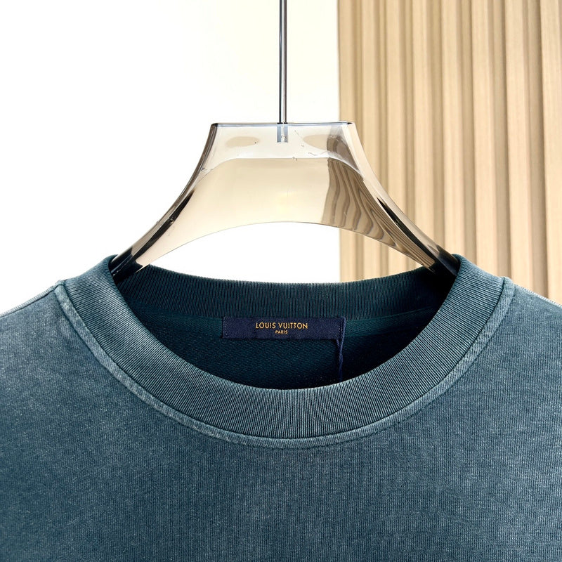Flat lay presentation of Louis Vuitton luxury clothing with everyday silhouette