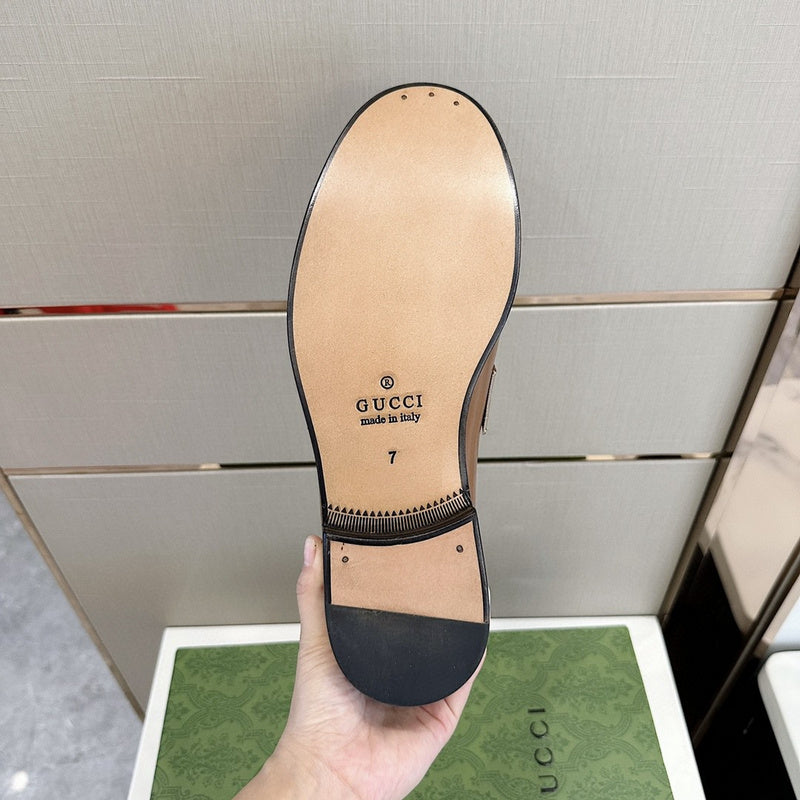 Side profile of Gucci muted earth tones sneakers retro runner design