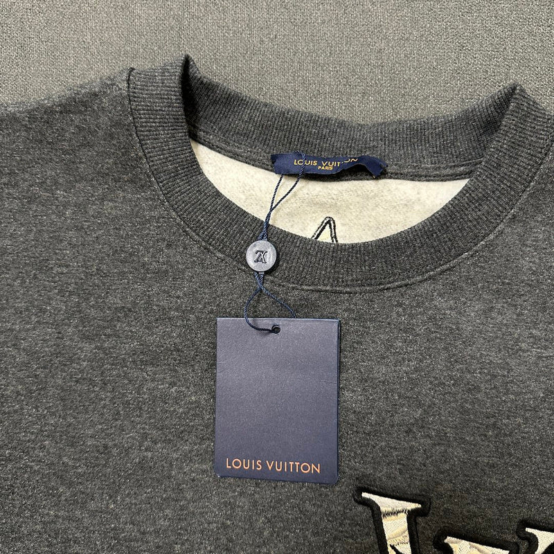 Full styled look of Louis Vuitton luxury clothing with logo-detail design