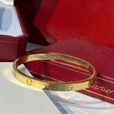 Side view of Cartier unisex jewelry piece