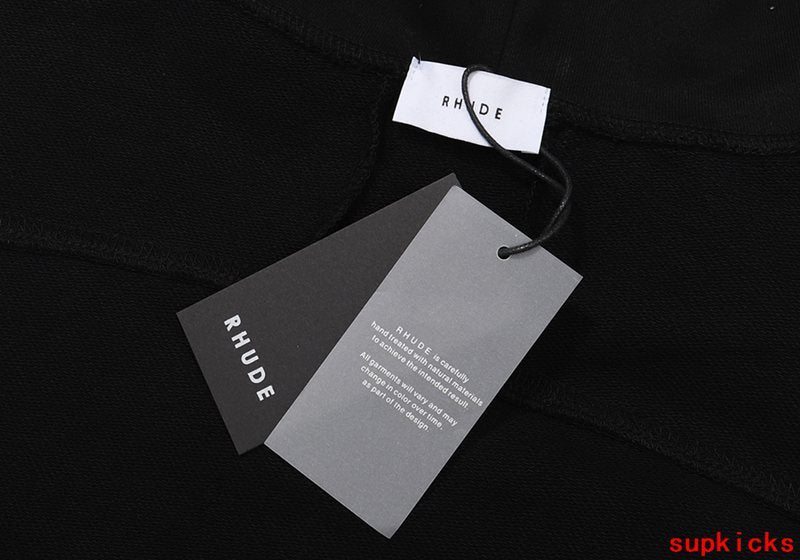 Close-up detail shot of Rhude luxury clothing with streetwear-inspired cut