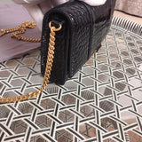 Handle and strap detail of sleek polished women's handbag – women's luxury handbag