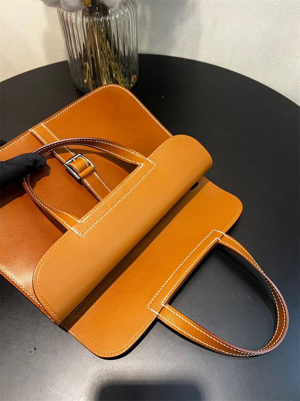 Side view of sculpted structured handbag
