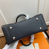 Styled lifestyle shot of structured statement women's handbag – women's designer-style accessory