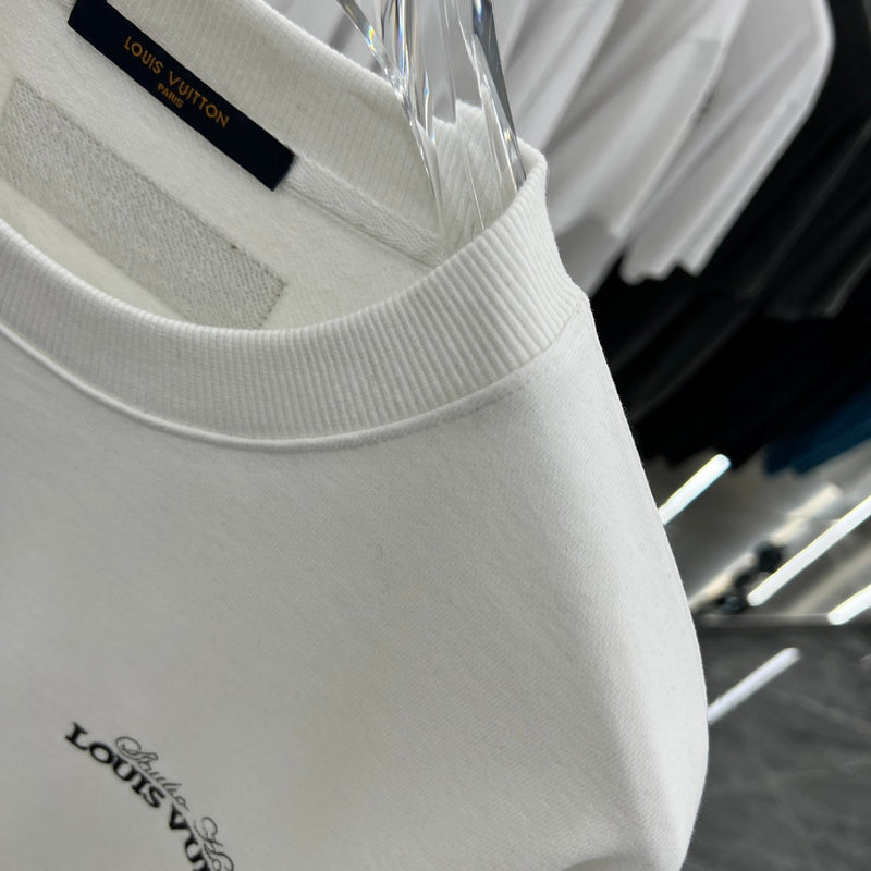 Flat lay presentation of Louis Vuitton luxury clothing with relaxed-fit cut