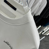 Flat lay presentation of Louis Vuitton luxury clothing with relaxed-fit cut