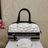 Side profile of polished structured women's handbag – women's everyday handbag
