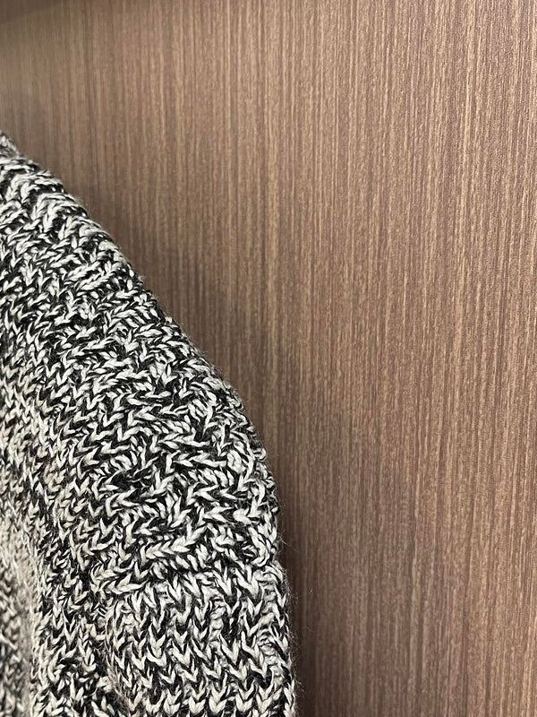 Close-up detail shot of Louis Vuitton luxury clothing with logo-detail design