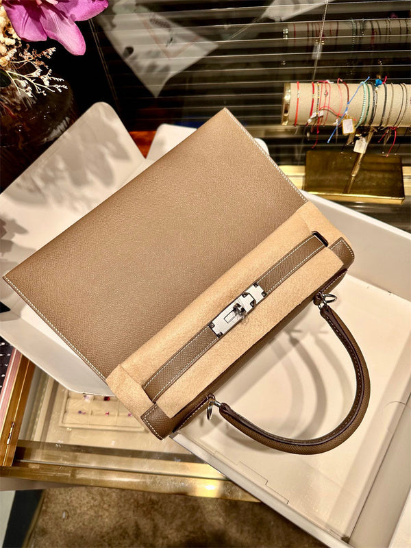  Structured top-handle bag carried on shoulder 10