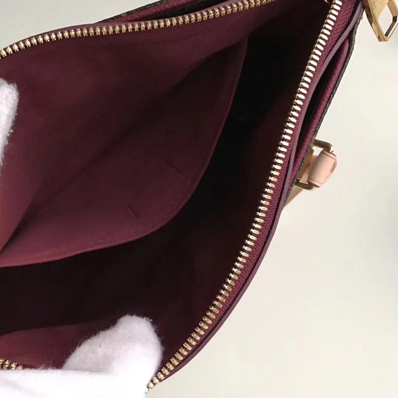 Back view of signature everyday-luxe women's handbag – women's statement bag