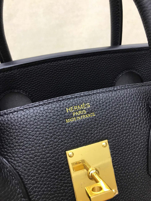Side view of considered structured handbag