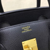 Side view of considered structured handbag