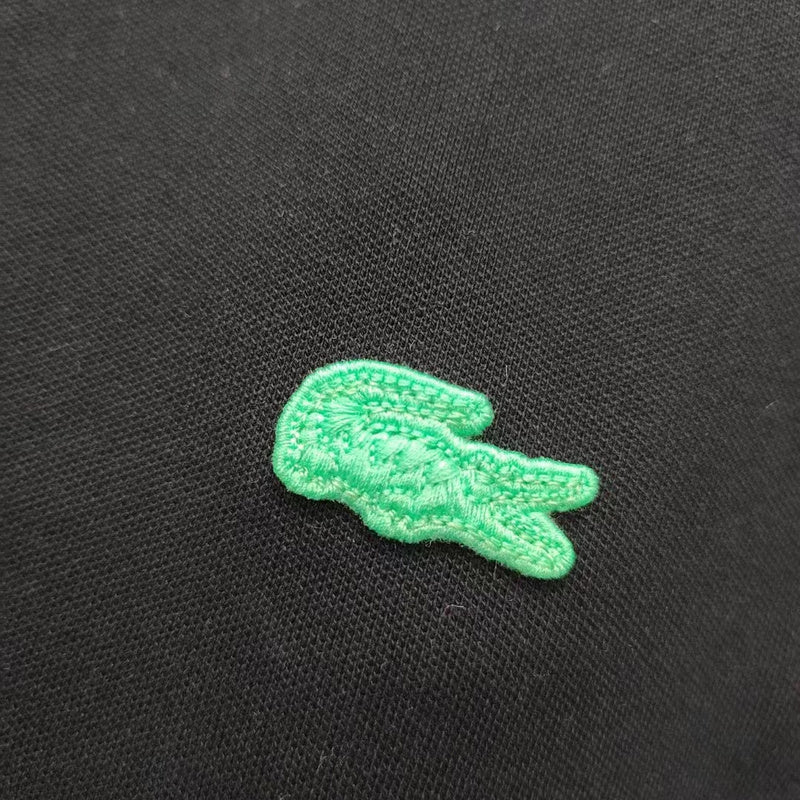 Front view of Lacoste luxury clothing with signature branding